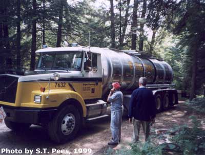 A new Volvo tank truck of Ergon Trucking, Inc. is shown leaving an oil lease 